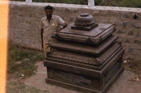 A man standing beside the S. V. Pattakkaarar&#039;s memorial
