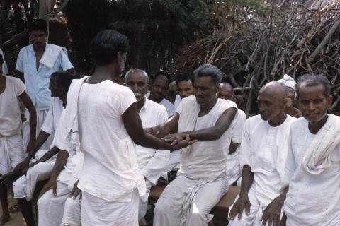 Village men gathered at a ritual